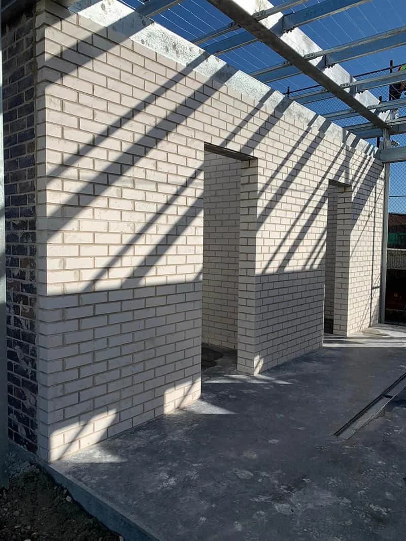 Cream brick walls under construction