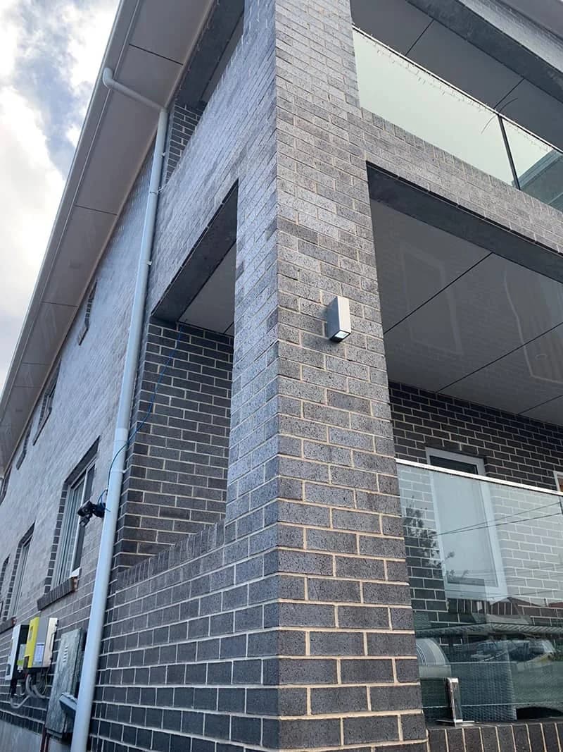 Dark brick apartment corner