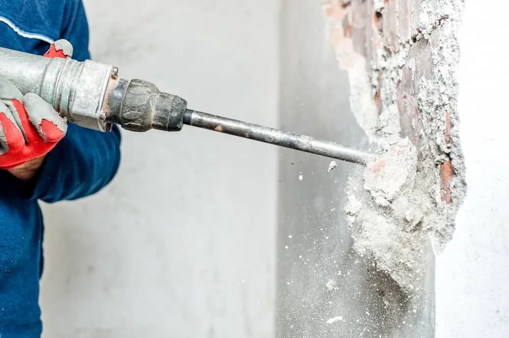 Jackhammer brick wall demolition