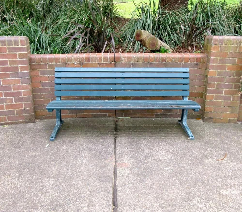 Red brick garden wall with bench