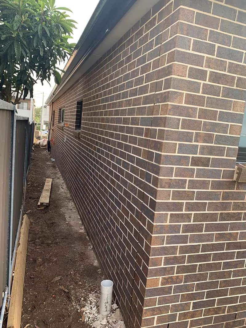 Close view of a face brick wall and corner joints